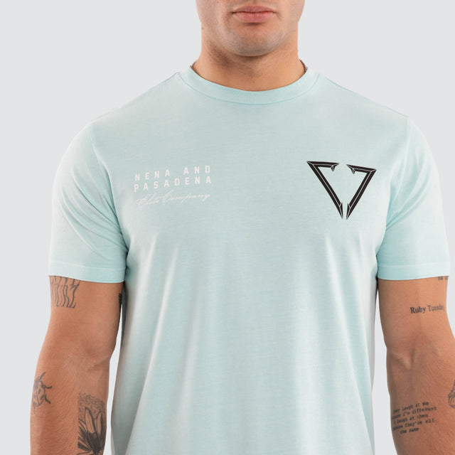Model wears NXP Eidolon Curved Hem Tee Pigment Blue T-Shirts in Blue - Image 4