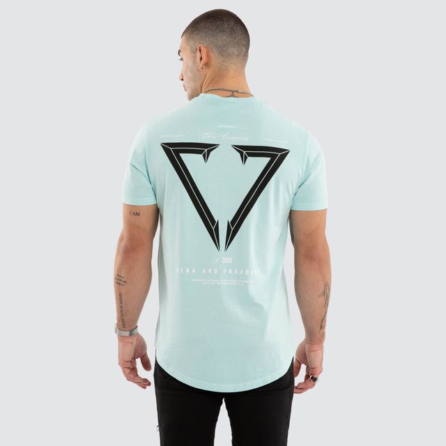 Model wears NXP Eidolon Curved Hem Tee Pigment Blue T-Shirts in Blue - Image 1