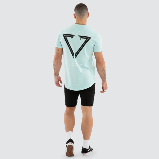 Model wears NXP Eidolon Curved Hem Tee Pigment Blue T-Shirts in Blue - Image 5