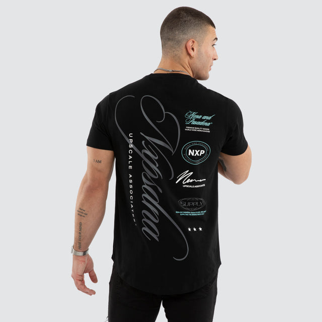 Model wears NXP Blackreach Curved Hem Tee Black T-Shirts in Black - Image 1