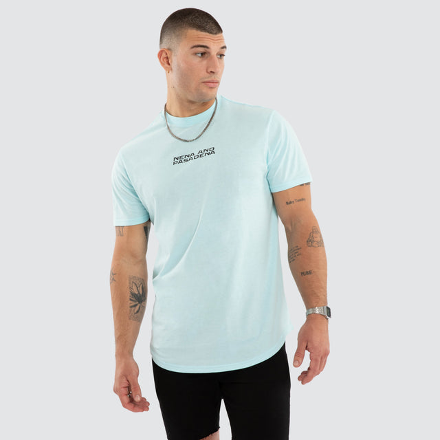 Model wears NXP Dawnrise Curved Hem Tee Blue T-Shirts in Blue - Image 2