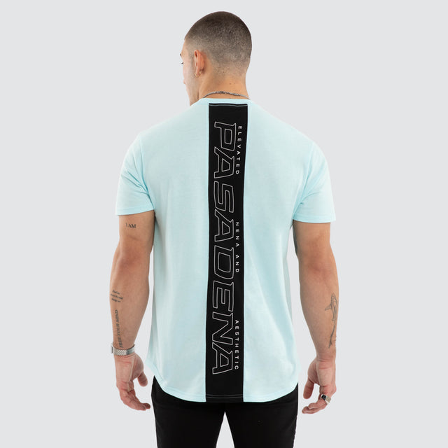 Model wears NXP Dawnrise Curved Hem Tee Blue T-Shirts in Blue - Image 1
