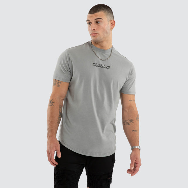 Model wears NXP Dawnrise Curved Hem Tee Grey T-Shirts in Grey - Image 2