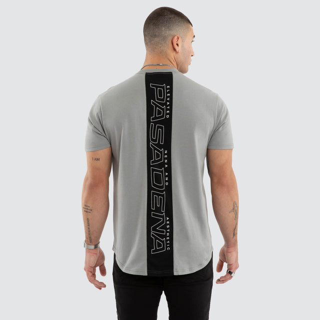Model wears NXP Dawnrise Curved Hem Tee Grey T-Shirts in Grey - Image 1