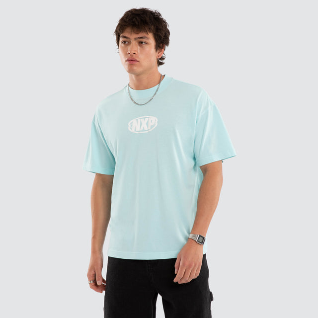 Model wears NXP Palladium Raptor Tee Blue T-Shirts in Blue - Image 2