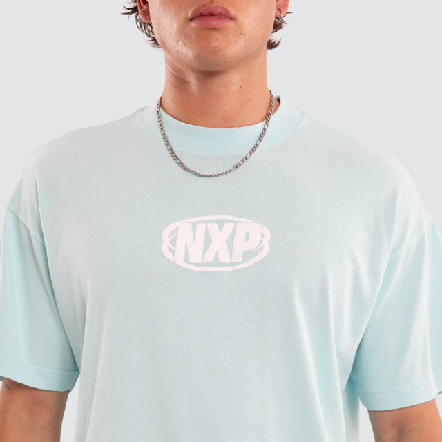 Model wears NXP Palladium Raptor Tee Blue T-Shirts in Blue - Image 4