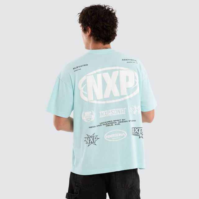 Model wears NXP Palladium Raptor Tee Blue T-Shirts in Blue - Image 1