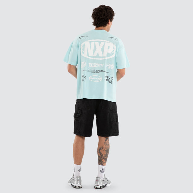 Model wears NXP Palladium Raptor Tee Blue T-Shirts in Blue - Image 6
