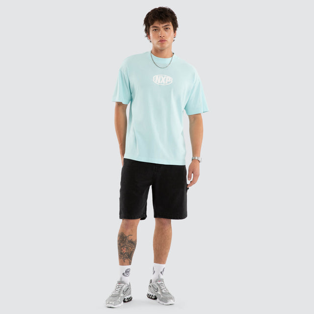 Model wears NXP Palladium Raptor Tee Blue T-Shirts in Blue - Image 5