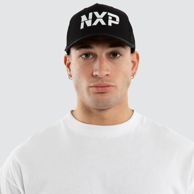 Model wears Axis Cap Jet Black Caps Black – image 2