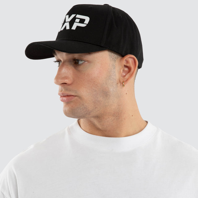 Model wears Axis Cap Jet Black Caps Black – image 4