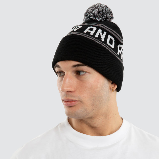 Model wears Crux Beanie Jet Black Headwear Black – image 4