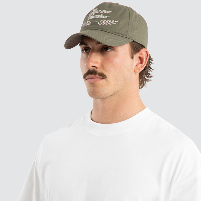 Model wears Legacy Cap Khaki Headwear Green – image 3