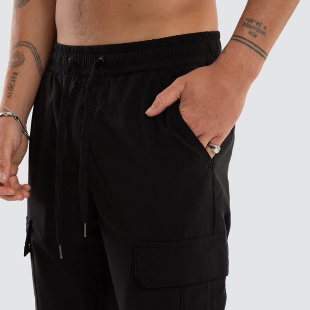 Model wears Delta Elastic Waist Nylon Cargo Pant Black Pants Black – image 5