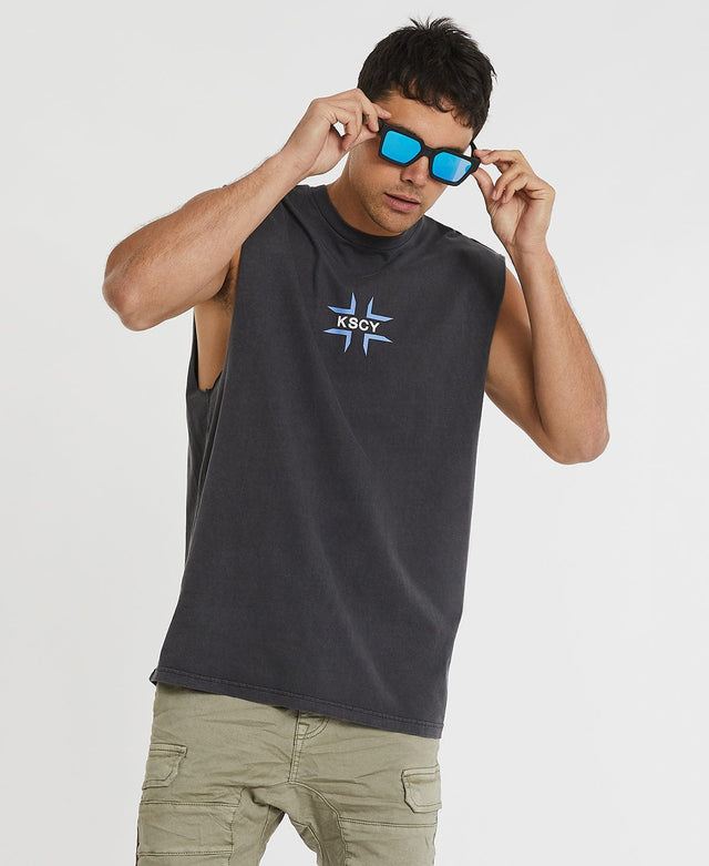 Man wearing relaxed fit, rocker-style dark grey muscle tee by Kiss Chacey, adorned with blue cross and white logo detailing.