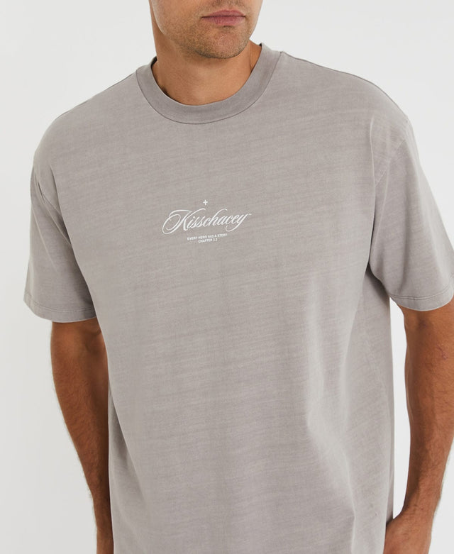 Man wearing Kiss Chacey's grey box ft t-shirt with ribbed crew neckline, designed with the brand's white cursive logo in the middle.