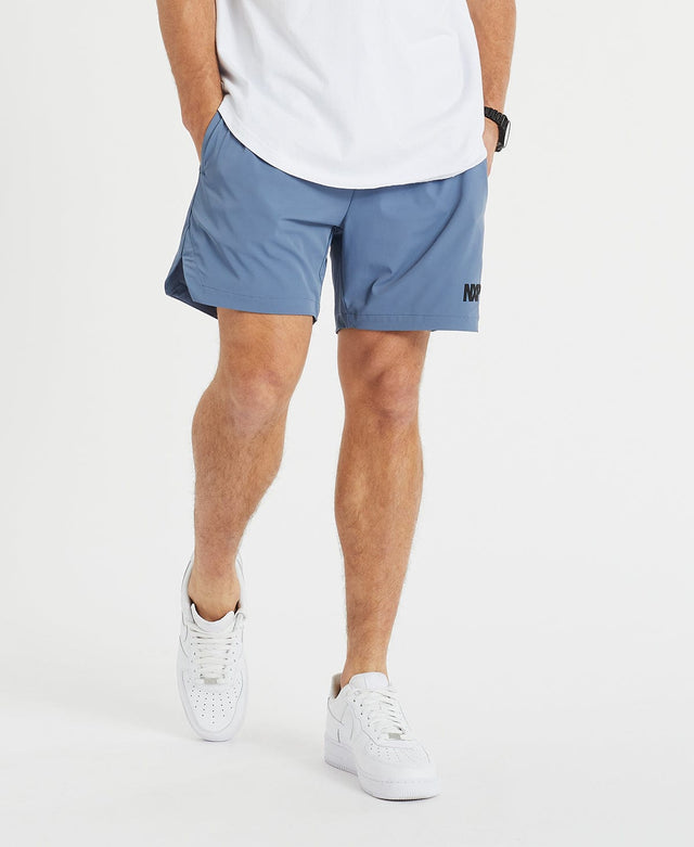 Model wears NXP's mens short shorts in blue