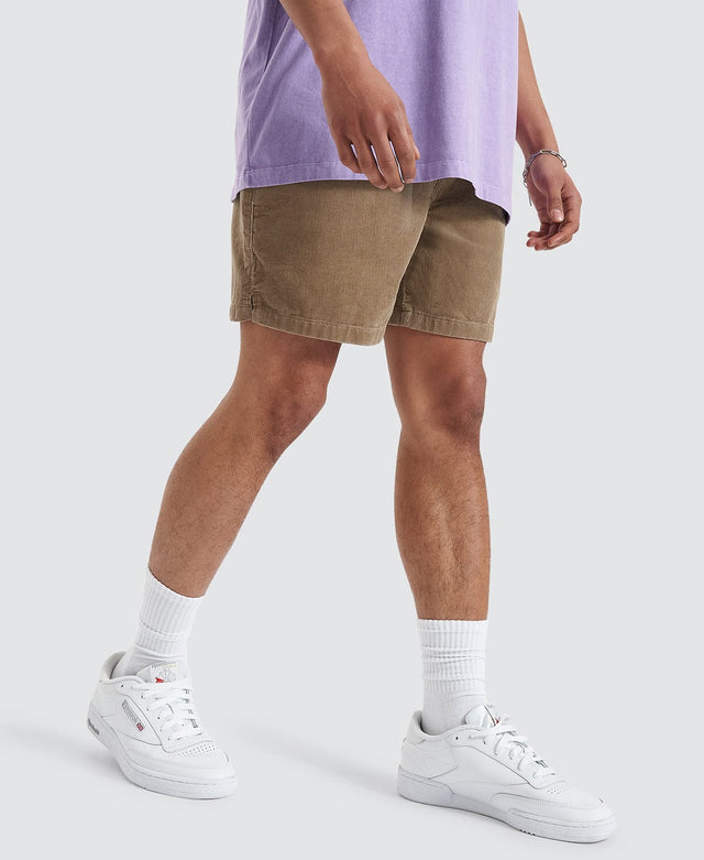 Man wears corduroy walk shorts by Nomadic