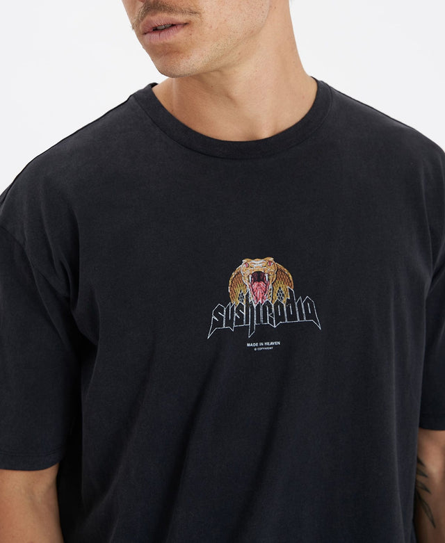 Man wearing a box fit t-shirt in black by Sushi Radio with ribbed crew neckline, featuring the brand's logo at the middle with a snake detail.