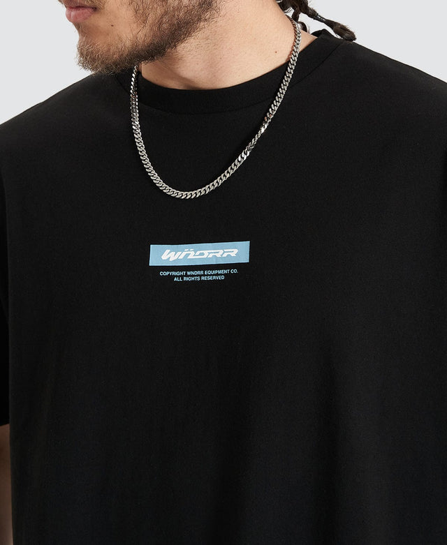 Man in a black box fit t-shirt with ribbed cew neckline by Wndrr, printed with the brand's logo in colour light blue and white.