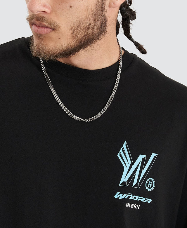 Man in a black box fit tshirt with ribbed crew neckline from the brand Wndrr, printed with the brand's logo in a a light blue colour.