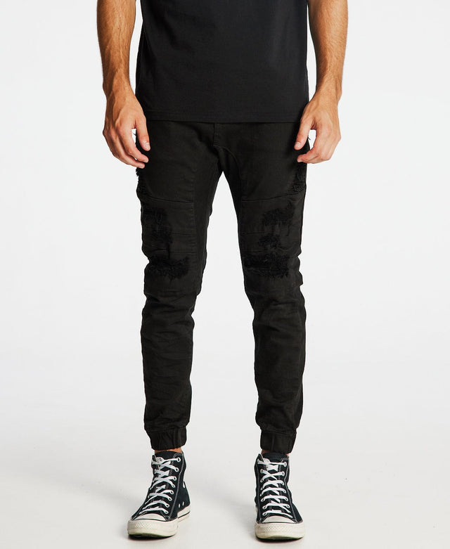 KSCY Hydra denim jogger pants for men in jet black with distressed details, resembling ripped jeans