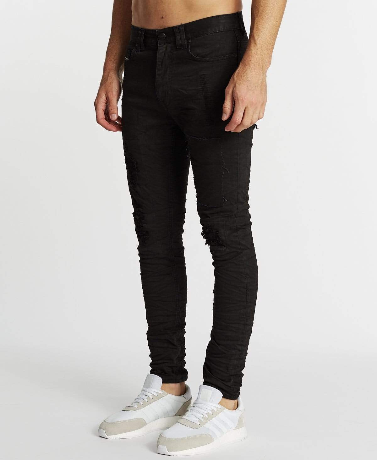 Destroyed black skinny store jeans