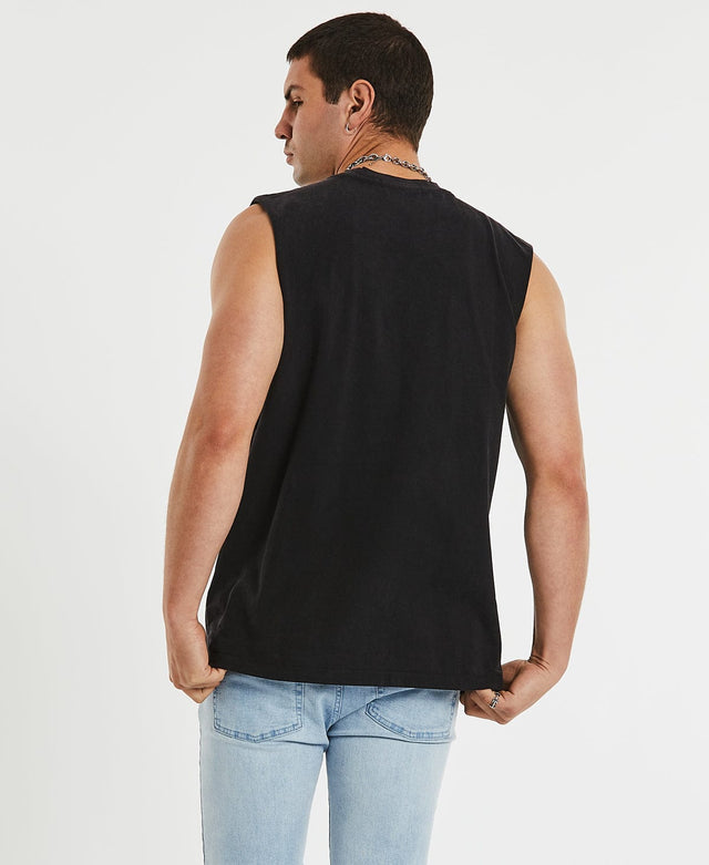 Man wearing relaxed fit, rocker-style black muscle tee by Sushi Radio, adorned with a white graffiti logo detailing.